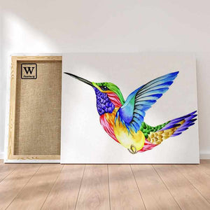 Première image de la peinture par numéro, Colibri Pop , dans un cadre en bois sur du parquet.