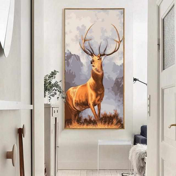 Première image de la peinture par numéro, Cerf Fier , dans un cadre en bois sur du parquet.