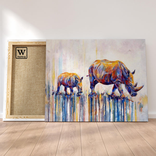 Première image de la peinture par numéro, Rhinocéros Peinturlurés , dans un cadre en bois sur du parquet.